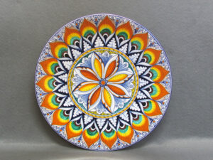 Piatto in ceramica di Faenza dipinto a mano