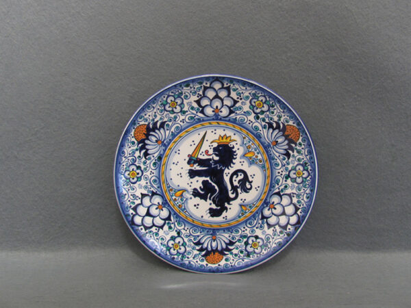 Piatto in ceramica di Faenza decorato a mano