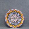 Piatto Pavona con fiore geometrico - diametro 24,5 cm - ceramica di Faenza dipinta a mano